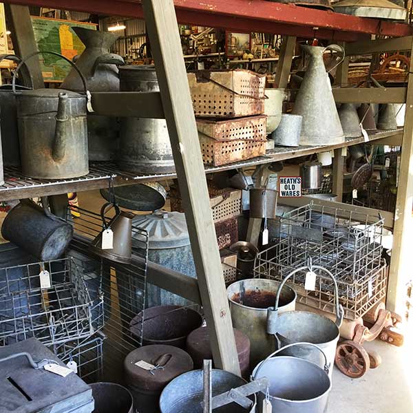 Industrial Antiques, farm tools, books, fishing floats, buckets, wire crates, cream cans, coppers, walking sticks, trunks, oars, anchors, grape buckets, oil pourers, collectables, scale weights, tools, art glass, vintage maps and more for sale at Heath's Old Wares, 19-21 Broadway, Burringbar, NSW 2483 Phone 02 6677 1181 open 7 days 9am - 5 pm