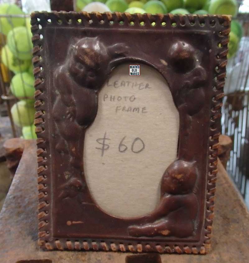 Antique leather photo frame for sale at Heaths Old Wares Collectables and industrial antiques, 19-21 Broadway Burringbar NSW, open 7 days Ph 0266771181