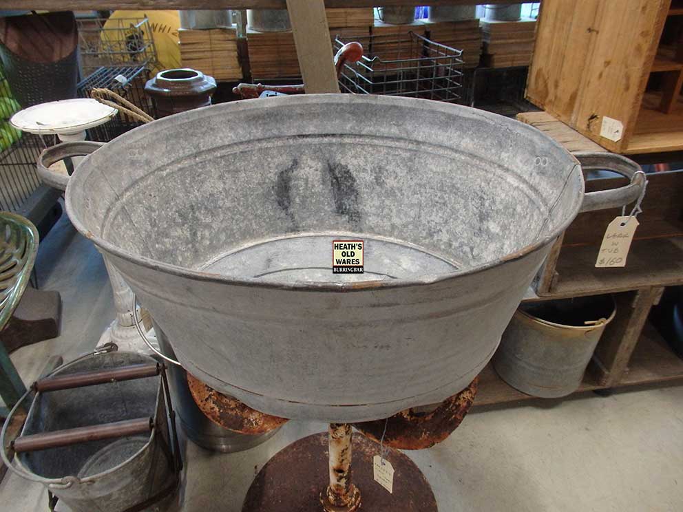 Antique oval galvanised wash tub for sale at Heaths Old Wares, Collectables, Antiques & Industrial Antiques, 19-21 Broadway, Burringbar NSW 2483. Ph: 02 6677 1181 open 7 days